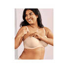 Wacoal Red Carpet Strapless Bra beige bra shown on model attaching one strap. 