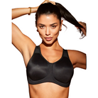 Woman wearing a black Wacoal Simone Underwired sports bra against a white background