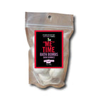 Packaged bath bombs with a label on a white background